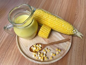 High angle view of yellow and vegetables on table