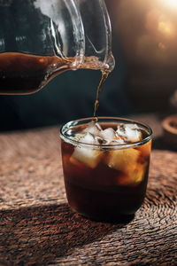 Pouring cold brew coffee