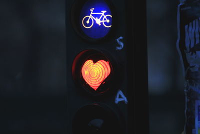 Close-up of illuminated road signs