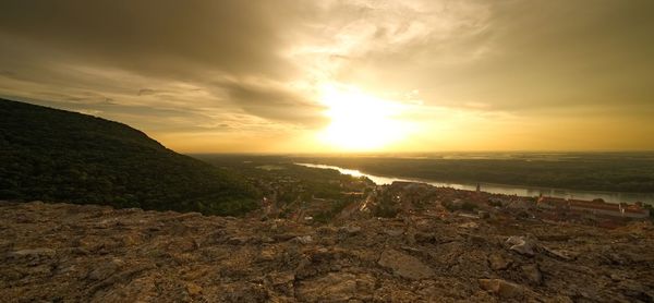 Scenic view of landscape against sky during sunset