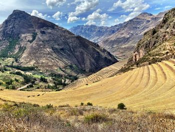 Scenic view of landscape and mountains against sky