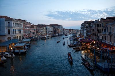 High angle view of canal in city at dusk