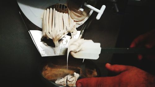 Close-up of man preparing food