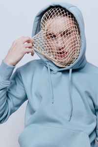 Portrait of young man wearing net