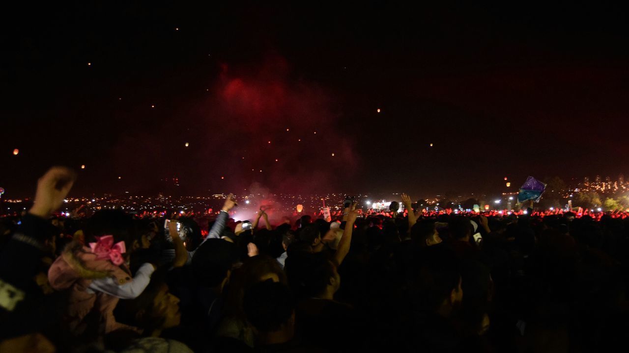 CROWD AT MUSIC CONCERT AGAINST SKY