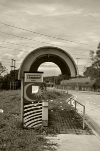 Information sign against sky