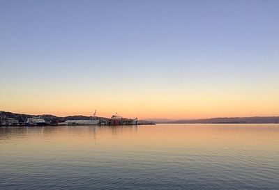 Scenic view of calm sea at sunset