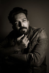 Portrait of young man against white background