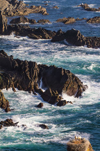 Scenic view of rocks in sea