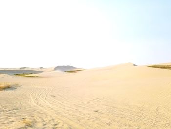 Scenic view of desert against clear sky