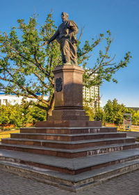 Low angle view of statue against sky