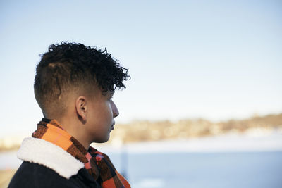 Teenage boy looking away