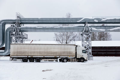 View of semi truck on snow covered land