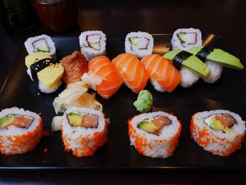 Close-up of sushi and sashimi in tray