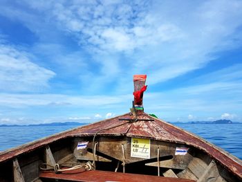 Lifeguard hut on sea against sky