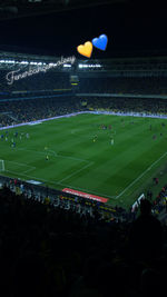 High angle view of people on soccer field