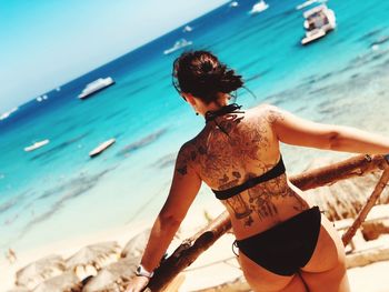 Rear view of woman on beach