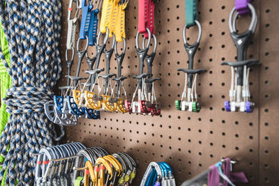 Close-up of climbing equipment hanging at store