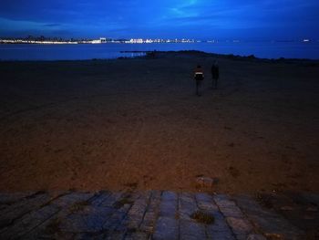 Man on beach against sky