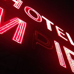 Low angle view of illuminated neon sign