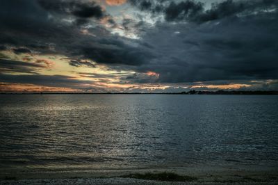 Scenic view of sea against cloudy sky