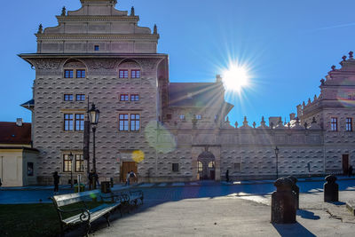 Buildings against blue sky on sunny day