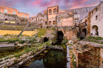 Interior of the roman amphitheatre of catania at sunset