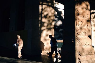 Full length of woman standing by railing