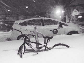 Cars parked on snow covered road