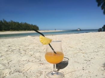 Close-up of cocktail drink on the beach with sunny sky in mauritius