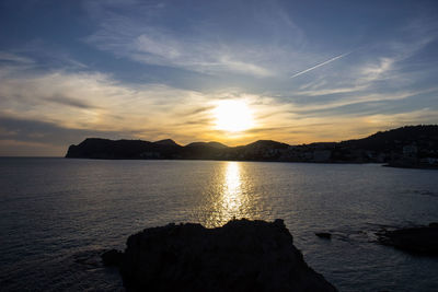 Scenic view of sea against sky during sunset