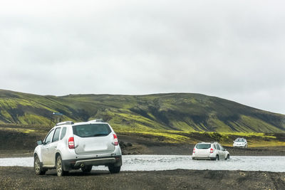 Cars are crossing the river.