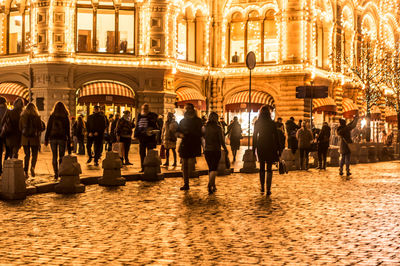 People on city street at night