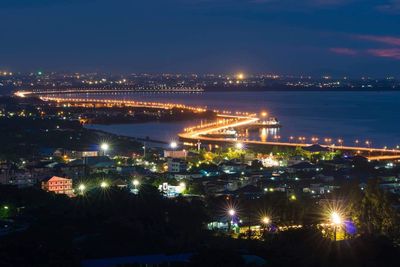 High angle view of illuminated buildings in city at night