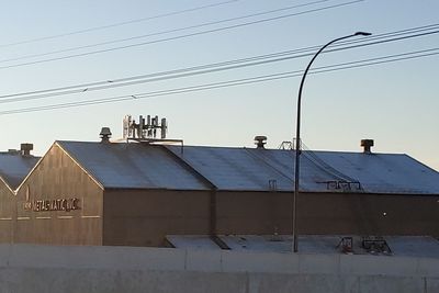 Low angle view of buildings against clear sky