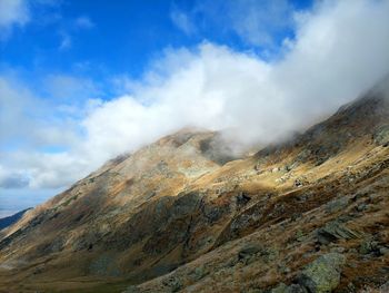 Scenic view of volcanic mountain against sky