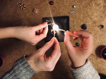 Midsection of man holding hands