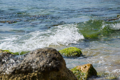 Sea waves splashing on rocks