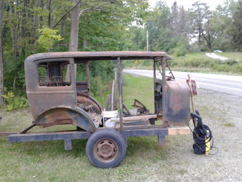 Abandoned vehicle on field