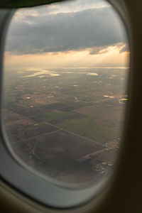 Aerial view of landscape seen through airplane window