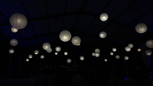 Illuminated lanterns at night