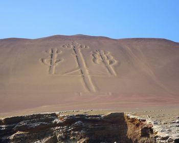 Scenic view of desert against clear sky