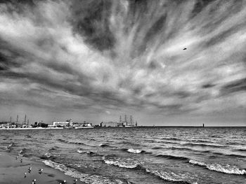 Scenic view of sea against cloudy sky