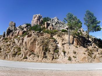 Rock formations in desert against clear blue sky