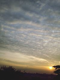Scenic view of cloudy sky at sunset