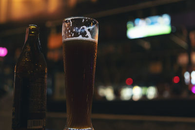 Close-up of beer glass on table