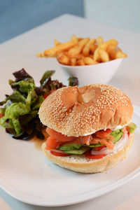 Close-up of sandwich with salmon and fresh vegetables