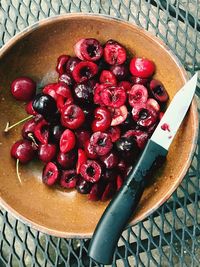 High angle view of strawberries in bowl on table