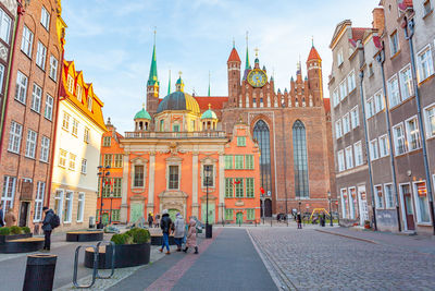 People walking on street in city