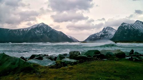 Scenic view of lake against sky during winter